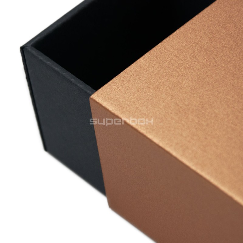 Two-piece small box for souvenirs with a bronze sleeve