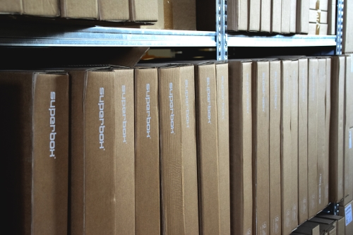 SUPERBOX Packaging Boxes with Logos SUPERBOX cardboard packaging boxes used for shipping. The boxes are branded with company logos, ensuring sustainable and professional product delivery.